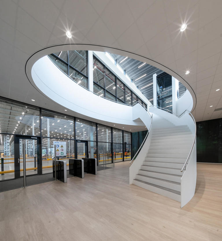 Impressive Stairway to second floor in entry hall of LKQ Fource in holland